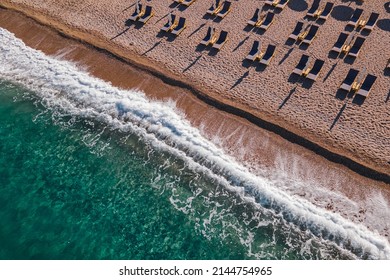 Beautiful Sandy Beach From Above. Aerial Drone View Empty Sunbeds On Beach No People. 