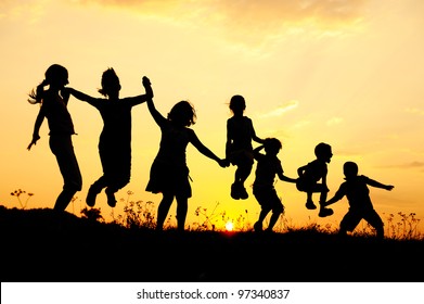 Beautiful scene of children jumping in nature - Powered by Shutterstock