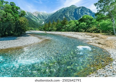 Beautiful scenery of Kamikōchi with fresh greenery. Azusa River and Hotaka Mountains - Nagano, Japan - Powered by Shutterstock