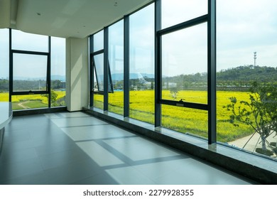 Beautiful scenery outside the glass window of the hall - Shutterstock ID 2279928355