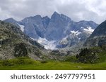 Beautiful scenery of Pyrenees National Park. Tourist trail to  Refuge des Oulettes de Gaube around mountain massif with glacier Oulettes and Vignemale - the highest peak of French Pyrenees. 