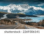 Beautiful scenery of Road trip on highway with rocky mountains and frozen lake at Icefields Parkway, Alberta, Canada