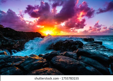 A beautiful scenery of rock formations by the sea at Queens Bath, Kauai, Hawaii at sunset
