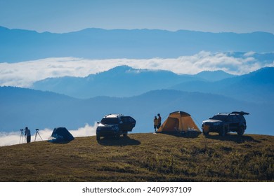 Beautiful scenery of the sea of mist in the morning at Camp Car Camping site with a viewpoint of is fresh nature of Doi Balu Kho Mountain, Mae Chaem, Chiang Mai, Northern Thailand. Background concept.