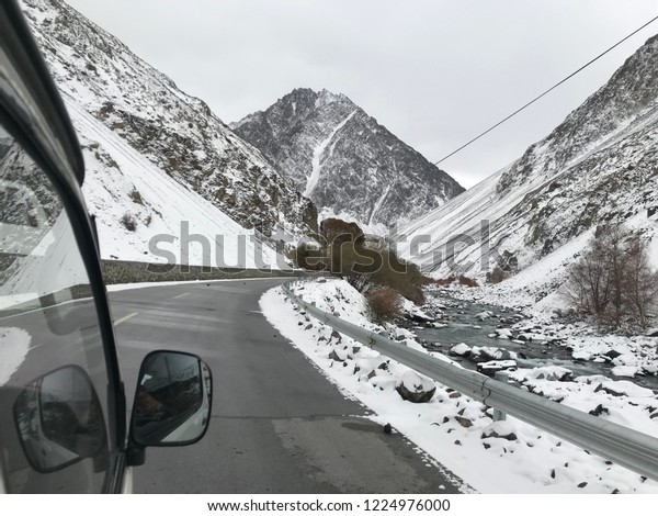 Beautiful scenery from tourism car of the snow covered\
lands in winter on the way to Khunjerap Pass,Pakistan-China Border,\
Highest Border crossing in the world,Gilgit-Baltistan,northern\
Pakistan 