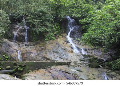 A beautiful scenery of tropical waterfall flowing through the beautiful tropical green forest with rock cover with moss.  - Shutterstock ID 546889573