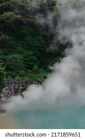 beautiful scenes of Japan nature. bright blue lake in mountains of Japan. green forest around. white steam above the hot water. wonderful nature of Asia