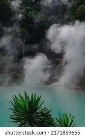 beautiful scenes of Japan nature. bright blue lake in mountains of Japan. green forest around. white steam above the hot water. wonderful nature of Asia