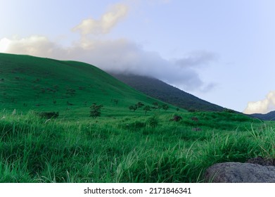 beautiful scenes of Japan nature. summer background with green grass on the hills and blue sky with clouds