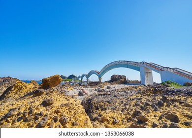 Beautiful Scenic Of Sanxiantai Arch Bridge With Blue Ocean With Three Saint Island In Behind At Chenggong District In Taitung City, Taiwan.