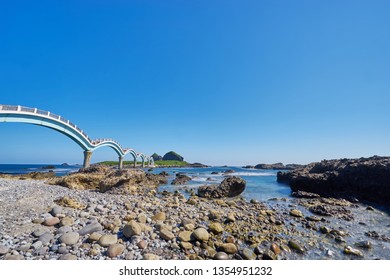 Beautiful Scenic Of Sanxiantai Arch Bridge With Blue Ocean With Three Saint Island In Behind At Chenggong District In Taitung City, Taiwan.