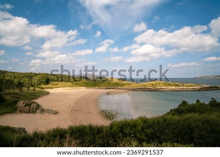 Beautiful Scenic shell beach and sea print in summer in Ards forest park and nature reserve in county Donegal on the wold Atlantic way in Ireland.  With blue skies and light cloud.