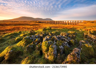 Beautiful scenic view with golden morning light at Ribblehead Viaduct in The Yorkshire Dales National Park, UK. - Powered by Shutterstock