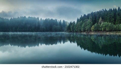 Beautiful scenic view of Savsat Karagol Black lake in Eastern Black Sea region with morning evaporation. Savsat Karagol lake is a large trout lake in the forest in Artvin, Turkey - Powered by Shutterstock