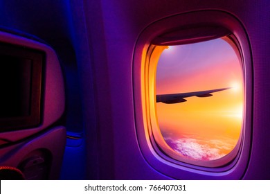 Beautiful scenic view of sunset through the aircraft window. Image save-path for window of airplane.