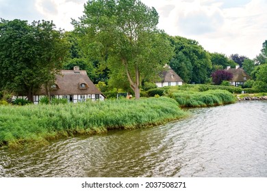 Beautiful Schlei region in Germany, Schleswig Holstein. German landscape in summer. Schlei river and typical houses with thatching, water reed roofs. Sieseby village
