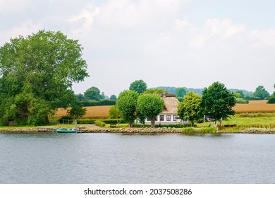 Beautiful Schlei region in Germany, Schleswig Holstein. German landscape in summer. Schlei river and typical houses with thatching, water reed roofs.