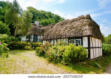 Beautiful Schlei region in Germany, Schleswig Holstein. German landscape in summer. Schlei river and typical houses with thatching, water reed roofs. Sieseby village