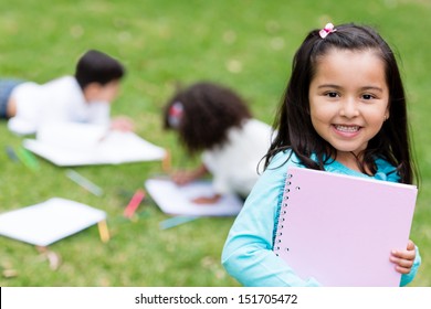 Beautiful school girl looking very happy outdoors 