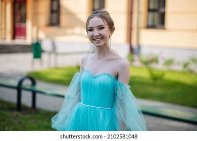 Beautiful Schoolgirl In Dress At The Prom At School.