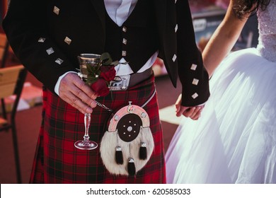 Beautiful Scottish Couple Groom And Bride. National Traditional Clothing - Kilt.