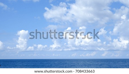 Similar – woman in red swimsuit walks by the sea. blurred