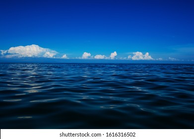 Beautiful Sea Horizon With Blue Sky And Clouds Close Up