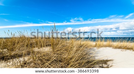 Beautiful sea landscape. Sandy beach and sand dune with grass, Leba, Baltic Sea, Poland