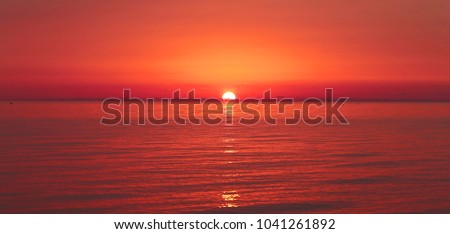 Beautiful sea sunset at the sea photographed in close-up