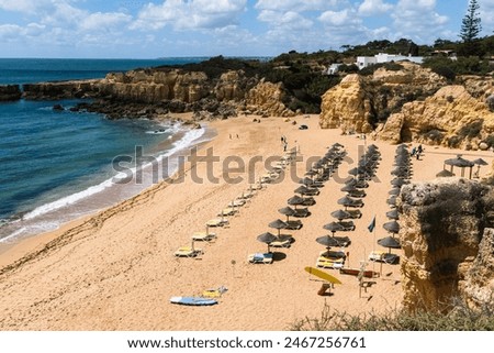Similar – Image, Stock Photo Sunset reflections at Praia Emilia’s rocky beach