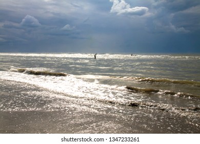 Beautiful Seascape With Cloudy Sky In The English Channel, Deauville Beach. France. Tide. Rough Sea. People Swim In The Sea. Cloudy Day