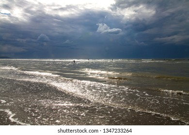 Beautiful Seascape With Cloudy Sky In The English Channel, Deauville Beach. France. Tide. Rough Sea. People Swim In The Sea. Cloudy Day