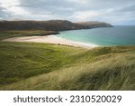 Beautiful seascape landscape over headland and sandy bay at Reef Beach on the Isle of Lewis and Harris in the Outer Hebrides of Scotland, UK.