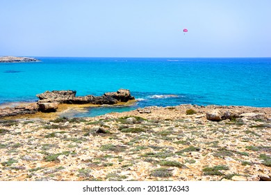 Beautiful seascape, rocky coast and blue sea. Summer landscape. Vacation by the sea. 