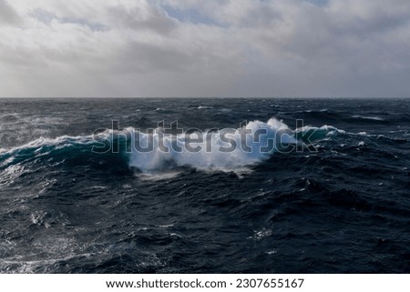 Beautiful seascape - waves and sky with clouds with beautiful lighting. Stormy sea, Bad weather. Gale. Rough sea.