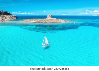 Beautiful seascape with white sailing yacht in summer on a sunny day aerial view. Popular beach La Pelosa, Sardinia, Italy. Travel, hobby concept - Shutterstock ID 2209236653