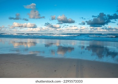 Beautiful seascapes with evening clouds reflected on the pacific ocean, Surfers Paradise Beach, Gold Coast, Queensland, Australia