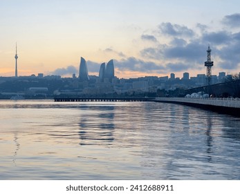 Beautiful seaside of Baku Boulevard during sunset. Best view of Baku: Caspian Sea and Flame Towers.