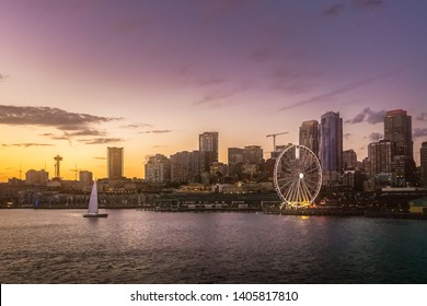 Beautiful Seattle waterfront skyline from Elliott Bay at dusk. Dreamy cityscape or scenery. Washington state, USA.