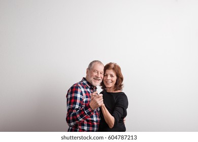 Beautiful Senior Couple In Love Dancing. Studio Shot.