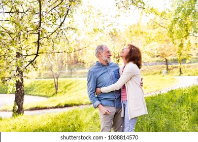 Beautiful Senior Couple In Love Outside In Spring Nature.