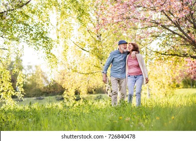 Beautiful Senior Couple In Love Outside In Spring Nature.