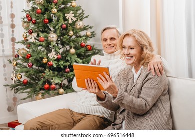 Beautiful Senior Couple Making Video Call On Christmas