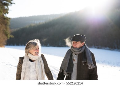 Beautiful Senior Couple On A Walk On Sunny Winter Day