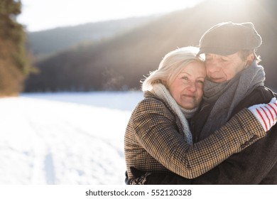 Beautiful Senior Couple On A Walk On Sunny Winter Day