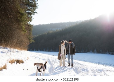 Beautiful Senior Couple On A Walk On Sunny Winter Day