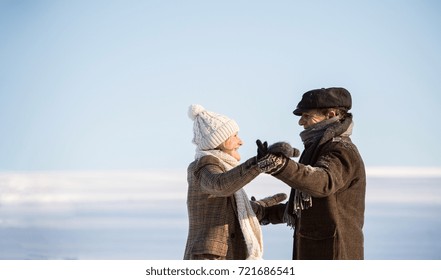 Beautiful Senior Couple On A Walk, Winter Day.