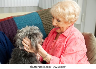 Beautiful Senior Lady Pats Her Adorable Mixed Breed Dog.