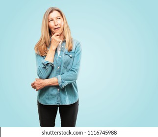 Beautiful Senior Woman With A Goofy, Dumb, Silly Look, Feeling Shocked And Confused At A Recent Realization, Not Really Understanding An Idea.