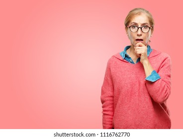 Beautiful Senior Woman With A Goofy, Dumb, Silly Look, Feeling Shocked And Confused At A Recent Realization, Not Really Understanding An Idea.